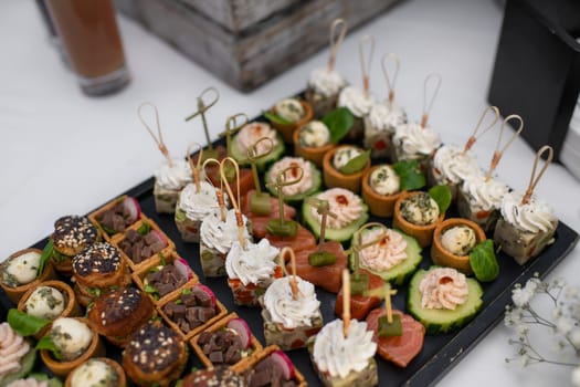 Small Canapes appetizers at the wedding