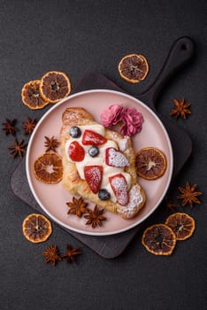 Food for breakfast sweet strawberry croissants with chocolate filling. French dessert, croissants with fruit and berries