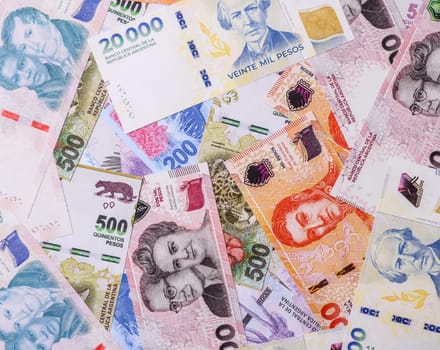 Background of Argentine peso paper money, notes with different denominations. Doing business, conceptual background