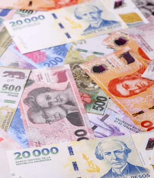 Background of Argentine peso paper money, notes with different denominations. Doing business, conceptual background