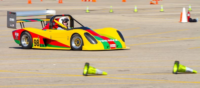 September 11, 2016 - Boise, Idaho: A yellow and green race car is driving on a track. The car is numbered 988.
