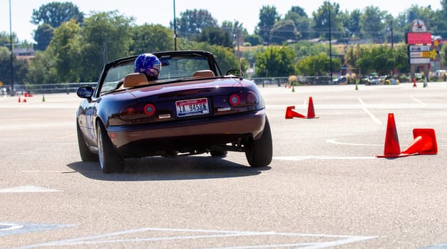 September 11, 2016 - Boise, Idaho: A man is driving a red mazda convertible on a SCCA autocross track