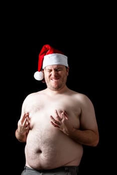 A man is wearing a Santa hat and is showing his chest. The image has a humorous and lighthearted mood