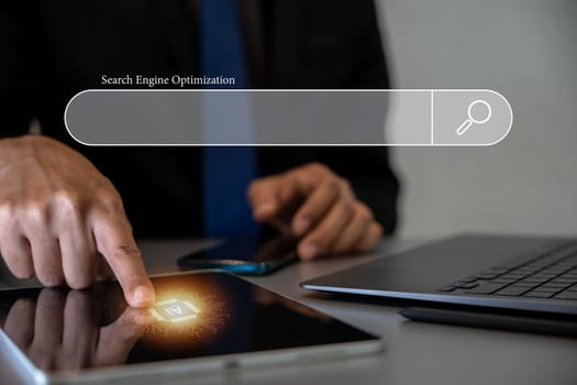 Digital marketing and SEO concept with man's hands using tablet computer. Searching for information and optimizing website for search engine results. Technology background