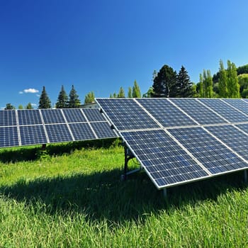 Solar power plant - concept for electricity and ecological industry. High energy prices. Beautiful landscape and sunny day with blue sky. Photovoltaic power plant.