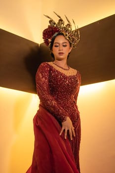 elegance woman wearing a red wedding dress with the crown on the wedding ceremony