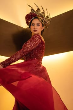 elegance woman wearing a red wedding dress with the crown on the wedding ceremony