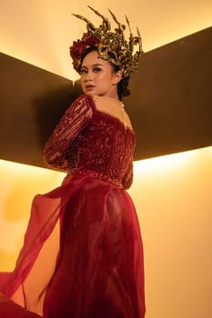elegance woman wearing a red wedding dress with the crown on the wedding ceremony