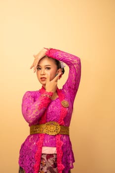 Beautiful bride from Balinese woman with pink dresses and make up on her face before the ceremony began