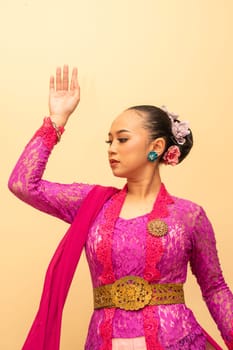 Javanese woman wearing traditional pink dress called kebaya on the Indonesian independence day