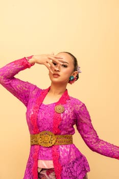 Beautiful bride from Balinese woman with pink dresses and make up on her face before the ceremony began