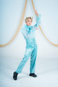 an Asian woman with blonde hair posing with her hands in a white studio