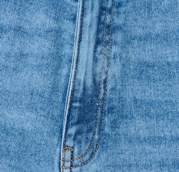 Close up of blue denim jeans showing the fly and zipper seam