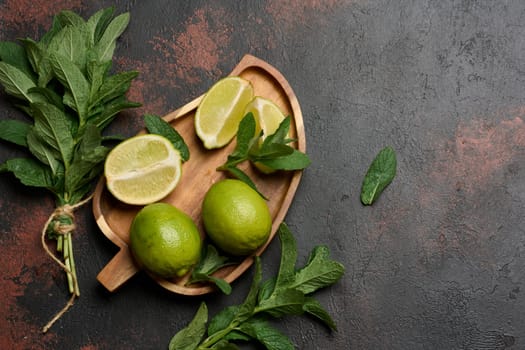 Bunch of fresh green mint and lime , top view