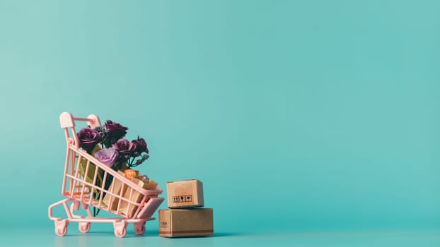 Shopping cart with box and bouquet of roses on blue background. Perfect for e-commerce, gift delivery, flowers, shopping, and Valentine's Day promotions.