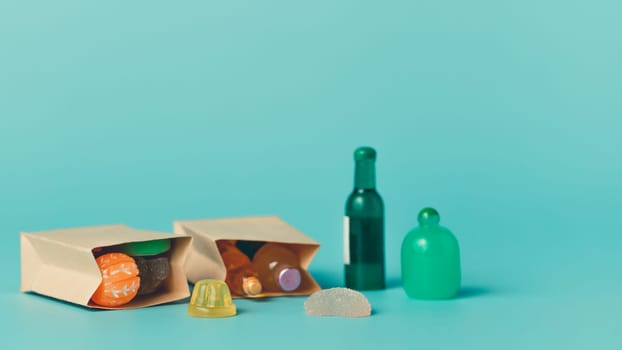 Takeaway food, snacks, and drinks in paper bag on blue background. Concept of delivery, fast food, lunch, meal prep, eco packaging, and copy space for advertising.
