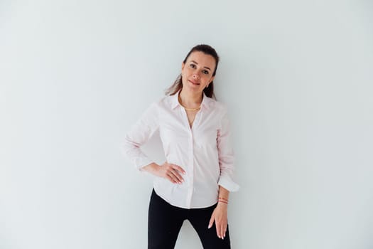Brunette woman in business suit posing on white background