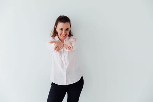 brunette woman stretching her hands forward and smiling
