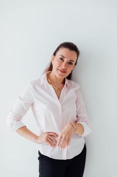 Brunette woman in business suit posing on white background