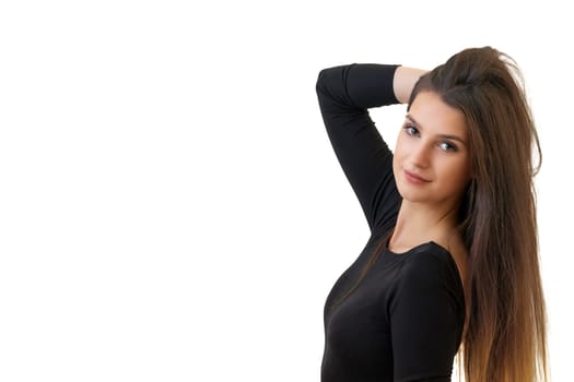 Studio waist up portrait of a beautiful young brunette long haired woman. Isolated on white background. Horizontally. 