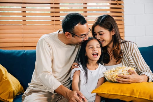 essence of family togetherness is captured as they gather on sofa watching TV and enjoying popcorn. father mother daughter and sibling share smiles and laughter epitomizing pure happiness.