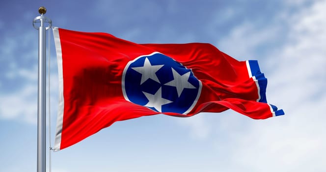 Close-up of the Tennessee state flag waving. Red field with a blue circle in the center containing three white stars. US state flag. 3d illustration render. Fluttering fabric. Selective focus