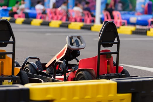 Red Go-kart sports action. Drivers gear up for a high-speed go kart race, ready to compete on the outdoor motorsport track.
