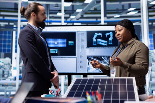 Solar panels plant manager presents manufacturing strategies and technology insights to investors. Photovoltaics factory executive uses data to highlight growth opportunities to shareholders