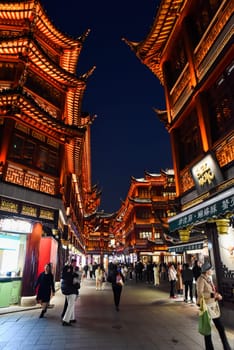 Shanghai, China - 1 April 2025: Shoppers explore Yuyuan Old Street, a bustling market area featuring traditional Chinese architecture and local goods