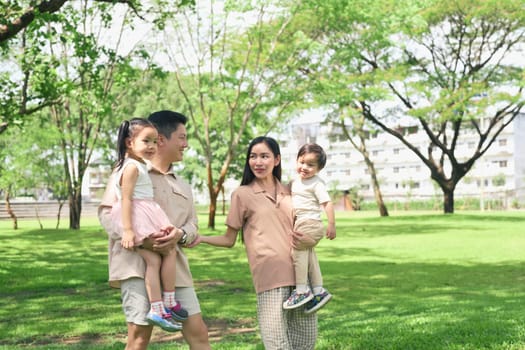 Happy family enjoying a sunny day in the park.