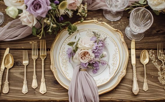 Elegant wedding table with floral centerpiece, gold accents and purple lavender details