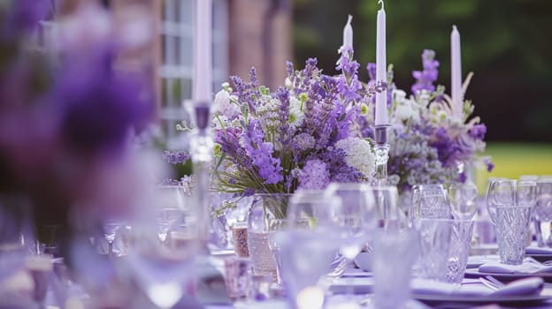 Outdoor wedding buffet table with lavender and a variety of dishes.