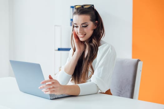 Business woman secretary with laptop in online office