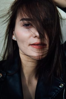 Face of gentle brunette woman with hair portrait