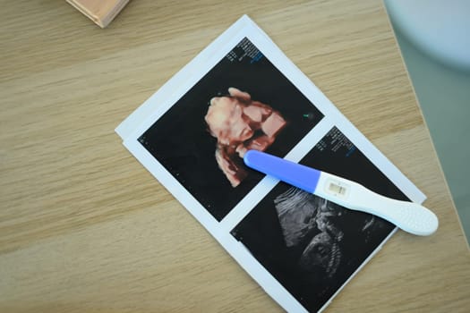3D and 2D ultrasound pictures with a pregnancy test. Fetal development concept.