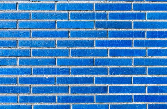 Close up of unique blue brick wall with luxurious ceramic effect, neatly laid bricks create pattern and texture, modern house facade design concept in Europe,