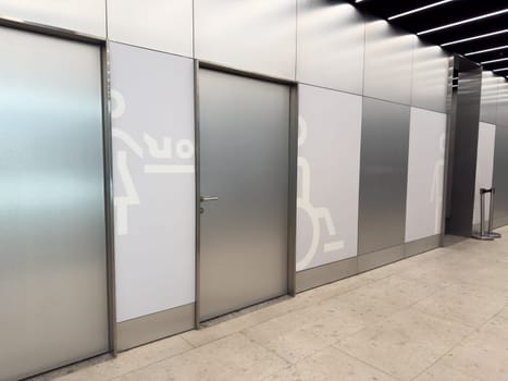 Public toilet zone with baby changing room and accessible restroom designed for hygiene and inclusive needs in modern indoor environment