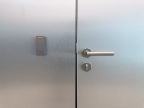 Closed metal office door with smart card reader and secure handle. Symbol of corporate access control, staff only zones, modern building security and workplace infrastructure