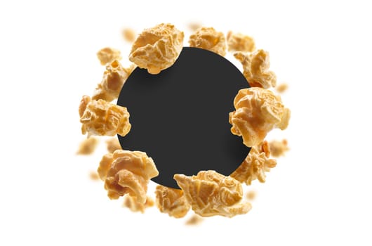 Caramel-flavored popcorn on a white background with a black circle in the center. The template for packaging