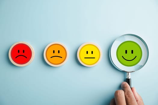 Magnifier in hand selected happy smiley face icon among emotions. Good feedback rating, positive customer review. Experience, satisfaction survey, mental health. Certificate demonstrates satisfaction.