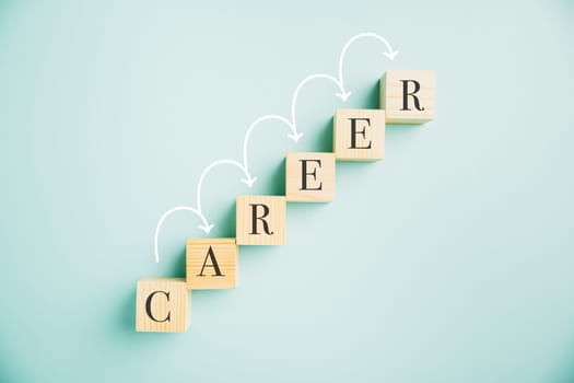 A compelling composition featuring a wooden cube block with the word CAREER against a vibrant blue background. Conveys the idea of business career planning, growth, and the steps towards success.