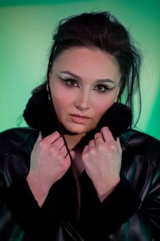 A captivating and stunning portrait showcasing a modern look accentuated by striking makeup and fashionable attire
