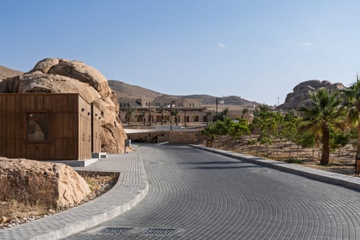 A picturesque view of Petra's cultural village, displaying shops with scenic rock formations.