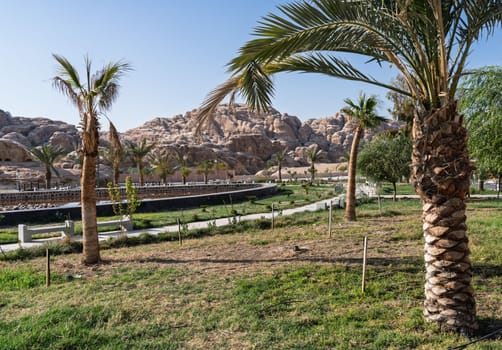 A picturesque view of Petra's cultural village, displaying shops with scenic rock formations.