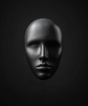 A black face with a black nose and mouth. The face is made of plastic and is very detailed