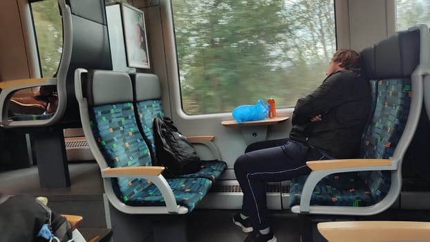 Prague Chech Republic Europe October 18 2024 -Train passenger sleeping. High quality photo