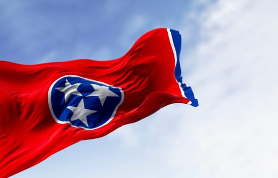Close-up of the Tennessee state flag waving. Red field with a blue circle in the center containing three white stars. US state flag. 3d illustration render. Fluttering fabric. Selective focus