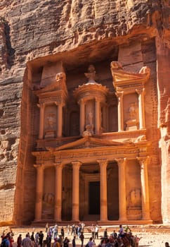 Petra, Jordan - 10 November 2024: Tourists at the carved facade of the Treasury building or Al-Khazneh in the ancient city of Petra