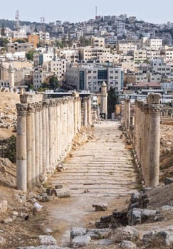 View down colonaded path towards the modern city in Jerash, a Greco-Roman well preserved city in Jordan