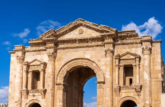 The monumental gateway of Hadrian's Arch in Jerash, a Greco-Roman well preserved city in Jordan